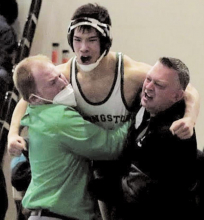 Wrestling Team Wins District XI Tournament; Take Region Titles; Qualify 5 for State Tourney