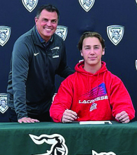 Playing collegiate lacrosse will be Evan Lastella, who will be on the New Jersey Institute of Technology (NJIT) men’s team. He is shown here with coach Brad Dzama.